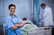 © WavebreakMediaMicro - Portrait of female nurse standing in ward