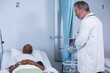 © WavebreakMediaMicro - Doctor interacting with patient during visit in ward