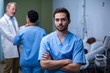 © WavebreakMediaMicro - Portrait of male nurse standing in ward