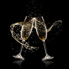 Two Glasses Of Champagne Over Black Background