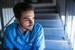 © WavebreakMediaMicro - Thoughtful male nurse sitting on staircase