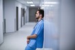 © WavebreakMediaMicro - Tensed male nurse leaning on wall in corridor
