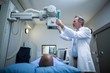 © WavebreakmediaMicro - Male doctor sets up the machine to x-ray over patient