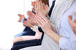 © rogerphoto - Close up of business people hands  clapping at conference