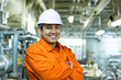 © momentscatcher - Happy asian engineer in workshop