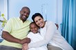 © WavebreakMediaMicro - Portrait of smiling parents and patient
