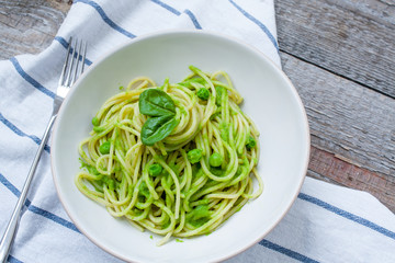 Wall Mural - Green pasta with pesto and peas. Love for a healthy raw food concept.