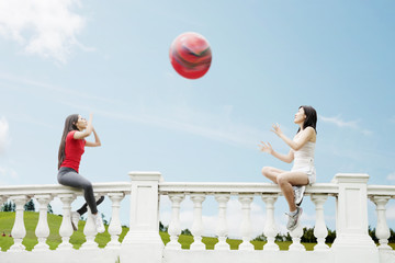 Poster - Young women playing with a big ball