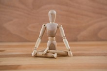 Wooden Figurine Sitting In A Lotus Position