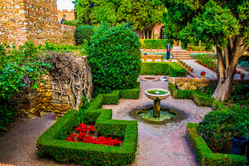 Wall Mural - view of a garden of the alcazaba fortress in the spanish city malaga