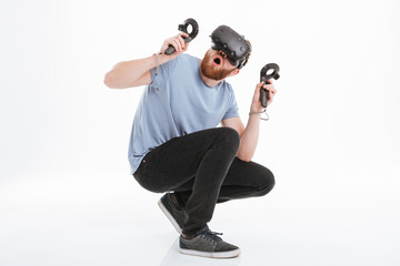 Sticker - Scared bearded man wearing virtual reality device