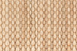 Bamboo woven beige mat handmade background. Wicker wood texture. Vertical strips.