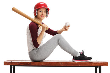 Poster - Woman posing with baseball and bat on wooden bench