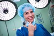 © WavebreakMediaMicro - Portrait of female surgeon standing in operation room