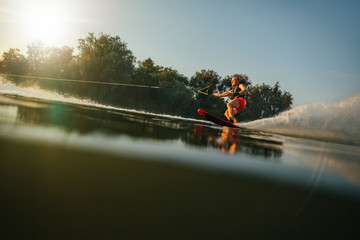 Athlete water skiing behind a boat