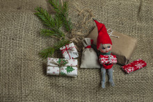Little Santa Helper Gnome Sitting With Christmas Holiday Present