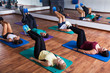 © JackF - People stretching in dance hall