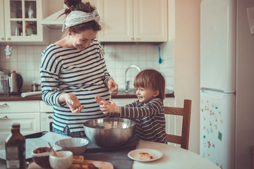 fun young pregnant mother   with son Toddler, make  dough for ba