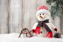 Snowman And Christmas Ball On Snow