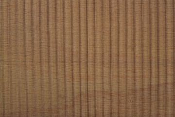 Black pleated transparent caprone cloth on a brown background