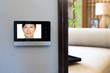 © zhu difeng - intercom video door bell on the wall outside modern bedroom