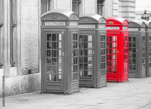 Naklejka na drzwi Five Red London Telephone boxes landscape in black and white with one red one
