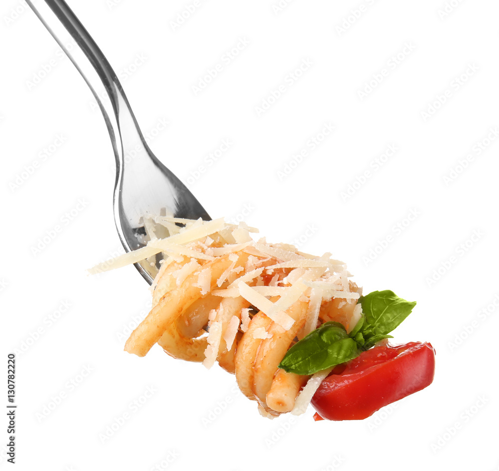 Fork with tasty pasta, cheese, tomato and basil isolated on white, close up view