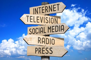 wooden signpost - media concept (internet, television, social media, radio, press).