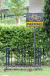 © noomcm - Parking sign and rack on green grass.