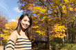 © leungchopan - Young asian woman in Autumn season
