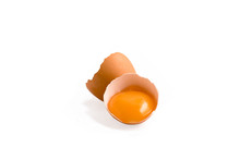 Egg Yoke In Cracked Eggshell Isolated On A White Background
