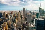 Fototapeta  - NEW YORK CITY: Observers view Midtown from Top of the Rock Rockefeller center. Manhattan is often described as the cultural and financial capital of the world.