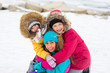 © Nichizhenova Elena - Group of young girls on the frozen lake