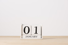 January 01 Cube Calendar On Wooden Table With Empty Space For Te