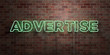 ADVERTISE - fluorescent Neon tube Sign on brickwork - Front view - 3D rendered royalty free stock picture. Can be used for online banner ads and direct mailers..