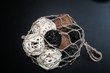 © Philipp - Straw globes in bag on black background