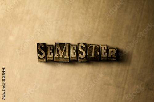 Fotografie, Obraz SEMESTER - close-up of grungy vintage typeset word on metal backdrop
