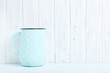 Blue jug on a wall paneling background