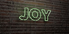 JOY -Realistic Neon Sign On Brick Wall Background - 3D Rendered Royalty Free Stock Image. Can Be Used For Online Banner Ads And Direct Mailers..