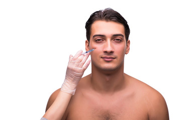 Man undergoing plastic surgery isolated on white