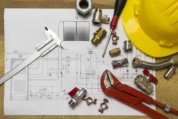 Office desk with hydraulic fittings, helmet  and project design