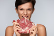 © puhhha - Eating Meat. Beautiful Woman Biting Raw Red Beef Meat With Teeth