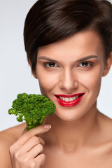 Wall Mural - Diet. Beautiful Smiling Woman With Green Broccoli, Healthy Food