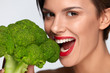 © puhhha - Healthy Diet. Beautiful Woman Eating Fresh Organic Broccoli.