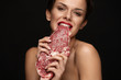 © puhhha - Eating Meat. Beautiful Woman Biting Raw Red Beef Steak Meat