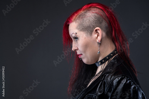Fotografie, Obraz Informal woman in leather jacket, profile