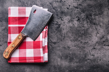 Wall Mural - Butcher. Vintage butcher meat cleavers with cloth towel on dark concrete or wooden kitchen  board.