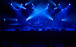 © Anatoliy Karlyuk - Perfect blurred background with blue concert lights, big stage. Electronic music concept.