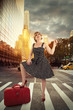 © michelaubryphoto - Street in New York city, sunrise in background. Pin up girl in first plan.