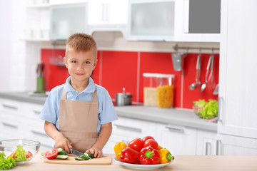 Poster - Little boy cooking in the kitchen